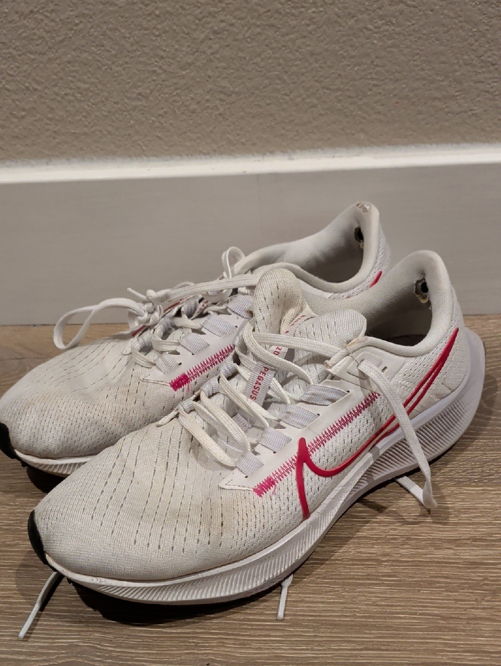 Nike Women's White Running Sneakers with Pink Swoosh